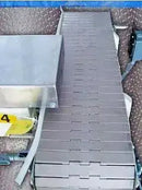 Sección del transportador con mecanismo de rechazo